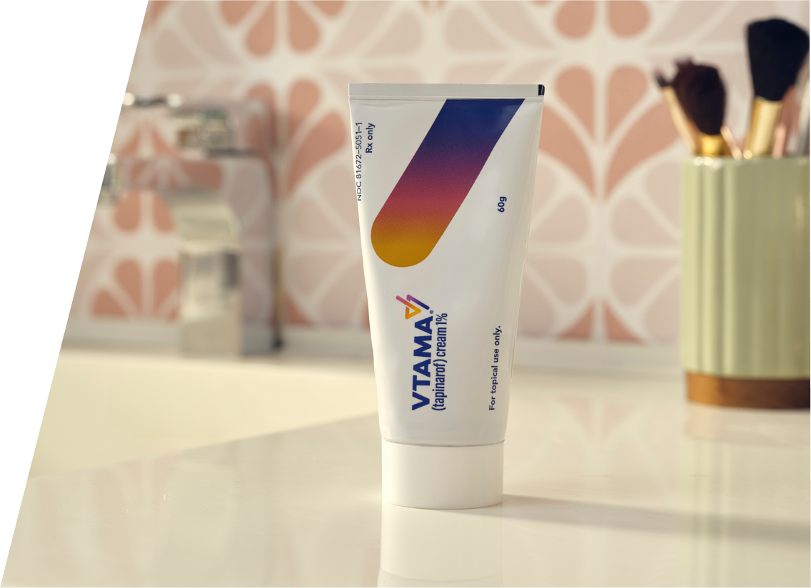 Hands squeezing VTAMA cream tube