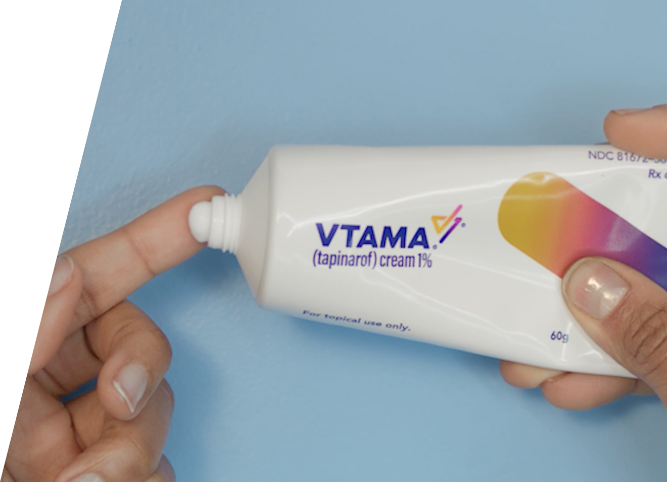 Hands squeezing VTAMA cream tube
